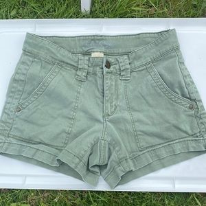 Shorts green button pockets